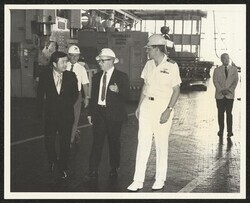 ["Caption: Tour: William D. Bennett; Superintendent of Mechanical Group, and long-time Superintendent of Structural Group, showed Senator Inouye through the Structural Group Shops. With him were Stanley Ziemlak; Superintendent of Shop 26, and Capt Kenneth E"]