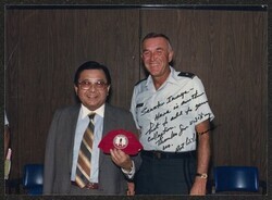 ["Information in title from back of photo. Signed on front: Senator Inouye - Here is another hat to add to your collection. Thanks for visiting us. Art Williams."]