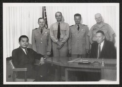 ["Caption: Inouye, Captain T. J. Knoll, U.S. Coast Guard, Commander F. C. Schmitz, U.S. Coast Guard, Capt. A. C. Unger, U.S. Coast Guard, Brig. Gen. A. L. Tynes, Commanding Gen. U.S. Army Tripler Gen. Hospital."]