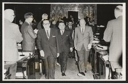 ["Caption: Olympia, Wash. Sen. Daniel K. Inouye (center), D-Hawaii, is led up the aisle of the Washington State Legislature by an honor guard Saturday. He spoke to a joint session of the Washington legislature."]