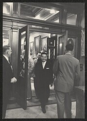 ["Label: Official 1133. DKI walking out of Speakers Lobby."]