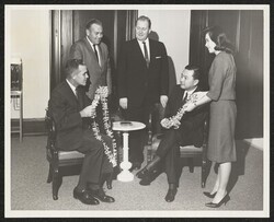 ["Caption: Monday, November 4, 1963. Washington to Waikiki. A group of 55, the largest this year, left Washington today for a fourteen day visit to Hawaii. U. S. Senator, Daniel Kay (sic.) Inouye and Miss Dale Wilhelm of the Senator's staff are displaying t"]
