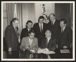 ["Caption: Personnel 1109 - Signing repayment contract for Molokai Project, Hawaii, June 3, 1963. Standing - Left to Right: Floyd E. Dominy, Commissioner of Reclamation, Senator Daniel K. Inouye, State of Hawaii, Congressman Thomas P. Gill, State of Hawaii,"]