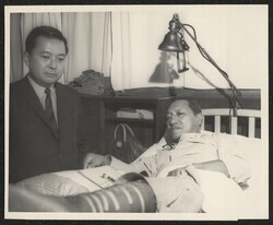 ["Caption: 1/28/67: Senator Inouye visits with patient Vingent Bungo, a merchant marine who lives with his wife, Lily, at 89598 Farrington Highway, Nanakuli, Hawaii. Stamp: Public Information Office U.S. Army Tripler General Hospital."]