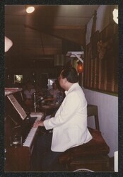 ["Caption: DKI at reception for Charles Davis at Kemoo Farm, Fall 1998. Photo from Ohulani Otto, 4/3/89."]