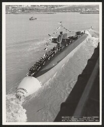 ["Caption: Launching ceremony. Elevated bow view. Mare Island Naval Shipyard. 16 January 1965. U.S. Navy Official Photograph."]