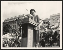 ["Information in title from back of photo: Reparations bill - speech. 1987. Senator Matsunaga in back"]