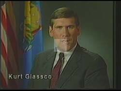 ["In this political advertisement, Kurt Glasgow promotes his candidacy by highlighting his background as a tough pRosecutor on crime and drugs, and his commitment to job security, strong defense, and caring for the less fortunate. He emphasizes the importance of honesty in a representative and solicits votes for the upcoming Tuesday election."]