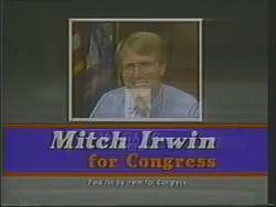["In the 1988 presidential campaign ad for Democrat Mitch Irwin, Bob Davis is depicted in a series of committee meetings being scrutinized due to possible ethical conflicts from accepting contributions from defense contractors. The focus is clearly on raising questions about Davis's integrity and potential influence from these financial ties."]