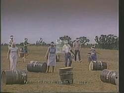 ["In the 1988 campaign ad for Democratic presidential candidate Lana Pollack, a series of disturbing scenes depict polluted landscapes and distressed communities impacted by industrial waste. The ad critically highlights the poor environmental record of Carl Purcell, juxtaposing images of pollution and health warnings with a final scene of Pollack advocating for environmental accountability before an attentive crowd."]