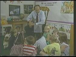 ["In the 1988 campaign ad for Democratic candidate Jim Leventis, a series of scenes depict diverse groups of young students in modern, technology-equipped classrooms. These images emphasize the campaign's focus on the importance and potential of education, showcasing engaged students interacting with digital devices and underlining the future challenges and readiness facilitated by such educational advancements. The scenes collectively symbolize hope and the pivotal role of education in societal progress."]