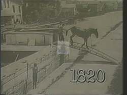 ["In the 1988 campaign ad, Congresswoman Louise McIntosh Slaughter demonstrates her commitment to local infrastructure by passionately advocating for urgent canal repairs in Fairport. Throughout the ad, Slaughter is seen speaking in Congress, emphasizing the necessity of immediate funding. Scenes of ongoing construction and community support underscore her effective leadership and dedication to development."]