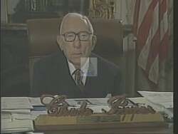 ["In the 1988 presidential campaign ad, Democratic candidate Howard Eliot Wolpe is depicted passionately advocating for senior citizens' rights and benefits. Across various settings, including a podium, a community hall, and a Budget Committee session, Wolpe focuses on protecting Social Security and Medicare, surrounded by supportive seniors and delivering his message with confidence and determination."]