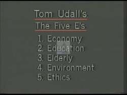 ["In a 1988 campaign ad, Democratic candidate Tom Udall emphatically addresses the necessity of investing in the education and future of children. The various scenes depict Udall speaking energetically at campaign events, with audiences responding positively and campaign paraphernalia highlighting themes of education and family values."]