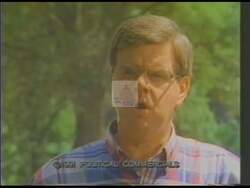 ["In his 1990 presidential campaign ad, Foster L. Campbell passionately addresses the severe economic distress impacting Louisiana's 4th District. Standing by a highway or at a podium, he calls for urgent federal intervention. His earnest plea highlights the local struggles, advocating for necessary economic aid and governmental attention."]