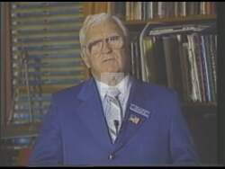 ["In a 1990 campaign ad, Republican candidate Peter J. Russo projects a confident, capable image, standing at podiums and passionately advocating for community-enhancing policies. Scenes highlight his commitment to environmental preservation, anti-crime initiatives, and tax repeals. Surrounded by supporters and \"Vote Russo\" signs, he emphasizes a message of positive change and strong leadership."]