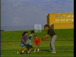 ["In the 1994 presidential campaign ad, Democratic candidate Stuart Price presents himself as a determined and successful businessman well-suited for leadership. Throughout the ad, Price confidently addresses the audience, standing in business environments and holding a football, symbolizing both his strategic prowess and his readiness to tackle national issues. The repeated imagery of the American flag and Washington D.C. backdrop emphasize his patriotic commitment and political aspirations."]