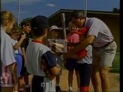 ["In Stuart Price's 1994 presidential campaign ad, he stands on a baseball field, coaching and mentoring children, showcasing his commitment to community and conservative values. He emphasizes honesty, integrity, and responsibility, paralleling these traits with his political agenda, while his campaign slogan underscores his dedication to these principles."]