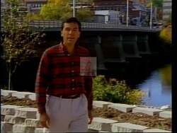 ["In the 1994 political TV ad for Rick Bennett, various scenes depict John Baldacci looking regretful and uncertain, often amid accusations of broken tax promises and policy flip-flops. Text overlays emphasize his perceived unreliability and contradictions in tax matters, contrasting this with Bennett's portrayed consistency and trustworthiness amidst Maine landscapes."]