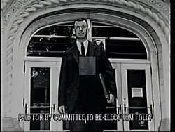 ["In the 1994 campaign ad, Democratic candidate Thomas S. Foley emphasizes his dedication to public safety and crime legislation. The ad portrays Foley as a confident speaker and devoted public servant, showcasing his legal expertise and legislative accomplishments. Scenes of Foley, often backed by American flags, reinforce his commitment to law enforcement and his role as Speaker of the House, advocating for police support and stringent crime laws."]