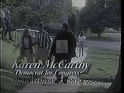 ["In her 1994 presidential campaign ad, Democratic candidate Karen McCarthy is depicted as a committed advocate for stringent gun control. Throughout various scenes, she is shown standing firmly in the State House, passionately opposing concealed firearms legislation and addressing both lawmakers and the public. Her determination positions her against the gun lobby, advocating for safer communities."]