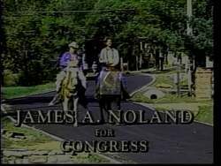 ["In the 1994 campaign ad, Republican candidate James A. Noland passionately addresses large crowds at various rallies, surrounded by American flags and campaign banners. His speeches focus on urging political change, combating liberal activism, and calling for voter support to protect American values under the \"Wake Up America\" campaign slogan."]