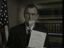 ["In the 1994 campaign ad for Harold Lee Volkmer, scenes vary from Volkmer shaking hands with factory workers to speaking at a podium. The ad strongly emphasizes Volkmer's advocacy for welfare reform, featuring family visuals, concerned crowds, and stressed taxpayers, all intertwined with banners and slogans promoting his welfare reform bill."]