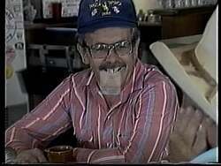 ["In his 1994 presidential campaign ad, Republican Jim Magagna fervently addresses crowds against majestic Wyoming landscapes, emphasizing his dedication to local control, self-reliance, and a rural renaissance. His speeches, full of passion and leadership, rally strong support for regional collaboration to secure a prosperous future for Wyoming."]