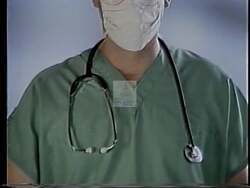 ["In the 1994 political TV ad for Democratic Party candidate Bob Schuster, Dr. John Hirschler, depicted as a healthcare reform advocate, proposes controversial financial solutions including higher payroll taxes and closing VA hospitals. Throughout various scenes, Hirschler, consistently portrayed in a serious demeanor, passionately discusses and defends his healthcare funding plans to diverse audiences, emphasizing drastic changes to improve healthcare systems, despite potential skepticism and backlash."]