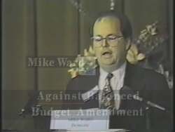 ["In a political TV ad for Susan B. Stokes' 1994 presidential campaign, scenes depict her opponent, Mike Ward, repeatedly speaking against key legislative reforms. Throughout various settings, Ward expresses his opposition to a balanced budget amendment and congressional term limits, highlighting a central theme of his resistance to these popular reforms."]
