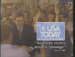 ["In the 1994 political ad, Ron Lewis, Republican candidate, addresses a vibrant crowd with confidence and determination. The scenes show Lewis standing at a podium during various campaign rallies, exuding leadership and sincerity. He passionately communicates his vision for positive change, surrounded by American flags and supportive attendees."]