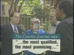 ["The 1994 presidential campaign ad for Democratic candidate Michael Delavan (Mike) Ward features him speaking vigorously at a podium, surrounded by campaign banners and an attentive audience. Additionally, Ward appears in a professional TV interview, confidently and persuasively discussing legislation, highlighting his commitment to addressing key issues."]