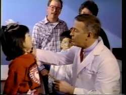 ["In the 1994 campaign ad, Republican John Greg Ganske, a surgeon transitioning to politics, presents his congressional ambitions. The scenes alternate between him in medical settings and campaign environments, emphasizing his dual identity as a healthcare professional and a dedicated family man. He advocates for integrity, common sense, and leadership, connecting his medical expertise to political problem-solving."]