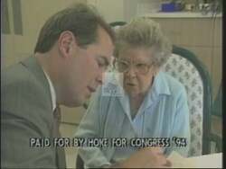 ["In the 1994 political TV ad for Republican candidate Martin Hoke, a series of scenes depict him on a stage, smiling and expressing gratitude toward a formally dressed, applauding audience in a celebratory atmosphere. The ad emphasizes appreciation and connection with supportive constituents, featuring multiple shots of Hoke acknowledging the crowd's applause."]