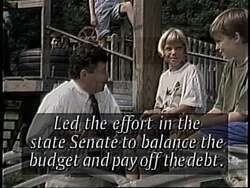 ["The 1994 campaign ad for John Carroll emphasizes his fiscal responsibility and contrasts it with Bernie Sanders' spending habits. Scenes include Carroll discussing budget plans and government spending rigorously while contrasting images and captions critique Sanders' fiscal policies. Carroll is portrayed as a confident leader, committed to balanced budgets and economical government spending."]