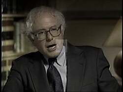 ["In the 1994 political campaign ad, Independent Party candidate Bernie Sanders passionately advocates for veterans' rights. Various scenes show speakers, including veterans and politicians, delivering heartfelt speeches at podiums in public settings, emphasizing support and rights for veterans post-service, underlined by attentive audiences and patriotic backdrops."]