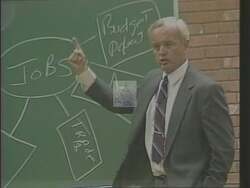 ["In the 1988 campaign ad, Democratic presidential candidate Tom Murray illustrates his dedication to education by engaging with diverse groups of students in a classroom setting. Through dynamic interactions and lively discussions on various subjects, he underscores his commitment to enhancing educational standards and reform. The ad portrays him as a passionate advocate for educational excellence."]