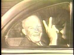 ["In the 1988 political ad for Democratic Party candidate James Claude Wright, scenes display his acclaim as a powerful orator and respected leader. Highlighted moments include Wright receiving standing ovations in Congress, delivering speeches with commanding presence, and accepting a prestigious public service award. The ad emphasizes his leadership qualities and cross-party respect."]