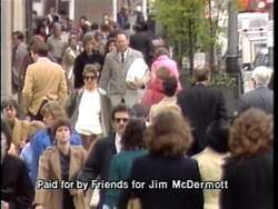 ["The 1988 campaign ad for Jim McDermott emphasizes his commitment to health care reform. Through various scenes of McDermott speaking at town halls, addressing both public audiences and direct to camera, he consistently advocates for combining effective, comprehensive health care with balanced federal budgets. The ad portrays him as a determined and empathetic leader, focused on fiscally responsible health care solutions."]