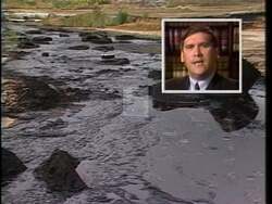 ["In his 1990 presidential campaign ad, Democratic candidate Kurt Glassco confronts environmental neglect starkly illustrated by polluted industrial landscapes. Amid scenes of dilapidated sites overrun with waste, Glassco pledges decisive cleanup actions, criticizing opponent Inhofe's inaction, and framing his commitment to environmental remediation as vital for community health and safety."]