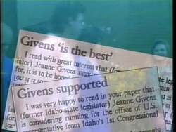 ["In her 1990 presidential campaign ad, Democratic candidate Jeanne Givens confidently addresses diverse, supportive crowds at various rallies, consistently presenting herself as a poised and dedicated leader. Scenes emphasize her legislative achievements and patriotism, with numerous American flags and campaign banners reinforcing her message of determination and leadership."]