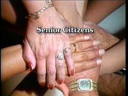 ["The political TV ad for Robert Samuel Kerr's 1990 congressional campaign prominently features diverse groups of citizens enthusiastically rallying in support of Kerr. Scenes show supporters from various backgrounds, holding \"Bob Kerr for Congress\" signs, gathered in community parks and public spaces, displaying unity and widespread community endorsement."]