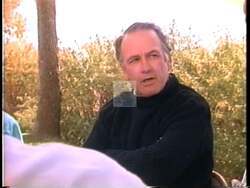 ["In the 1992 political TV ad for John Patrick (Pat) Williams, the Montana governor emphasizes the integration of education and economic strategies aimed at retaining the youth in Montana. He passionately speaks at various venues, from podiums to an office setting, underscoring job creation and economic sustainability to ensure a future where children thrive in their home state."]