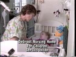 ["The 1996 presidential campaign ad for Republican Party candidate Andrea H. Seastrand showcases her comforting medically fragile children at the DeGroote home. The ad emphasizes Seastrand's compassion and nurturing demeanor as she interacts serenely with children in a homely environment, highlighting her commitment to overcoming bureaucratic obstacles to provide care."]