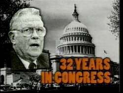 ["In the 1996 political TV ad targeting Republican Party candidate Jean Leising's opponent Lee Hamilton, the scenes emphatically highlight Hamilton's long tenure and perceived inefficiencies as a congressman. Frequent imagery of him surrounded by excessive paperwork and lavish settings underscores criticisms of his handling of fiscal policies and suggests disconnect from ordinary taxpayer concerns. The ad strategically frames Hamilton as both overwhelmed and overly comfortable in a power-laden, bureaucratic environment."]