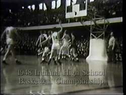 ["Lee Herbert Hamilton's 1996 presidential campaign ad evokes strong Hoosier values through scenes of basketball courts across Indiana. The visuals capture rustic hoops, enthusiastic young players, and communal gatherings, emphasizing dedication, teamwork, and local tradition. The recurring rural Indiana settings at sunset highlight a deep-rooted passion and enduring community spirit."]