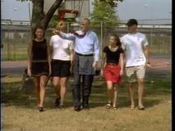 ["In the 1996 presidential campaign ad for Lee Herbert Hamilton, he passionately advocates for a fair and equitable budget that prioritizes education, family welfare, and equitable taxes. Scenes show Hamilton speaking emphatically at various podiums, emphasizing the need for governmental budgeting that fosters fairness and sustainability, focusing on the welfare of families, seniors, and the overall community."]