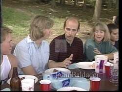 ["In his 1996 presidential campaign ad, John Elias Baldacci highlights his deep family and community ties, with scenes of lively family dinners and warm interactions at local events. The ad portrays Baldacci engaging with various constituents in Maine, emphasizing his strong local roots and commitment to familial and community values."]