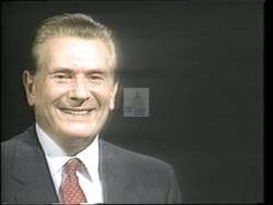 ["In the 1992 TV ad for Independent Party candidate Theodore (Ted) Shaver, the focus centers on his engaging campaign trail interactions. Shaver is seen confidently smiling and mingling with a diverse group of supporters and voters at various community events, emphasizing his approachability and widespread appeal. Prominent campaign signage and enthusiastic crowds reinforce his congressional bid."]