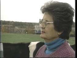 ["In her 1992 presidential campaign ad, Democrat Ada Deer passionately addresses concerns facing Wisconsin family farmers. Through various rally scenes, Deer critiques harmful trade policies, particularly GATT, advocating for fair trade that benefits local agriculture. The ad features Deer surrounded by supportive, distressed farmers, emphasizing the need for policy change."]